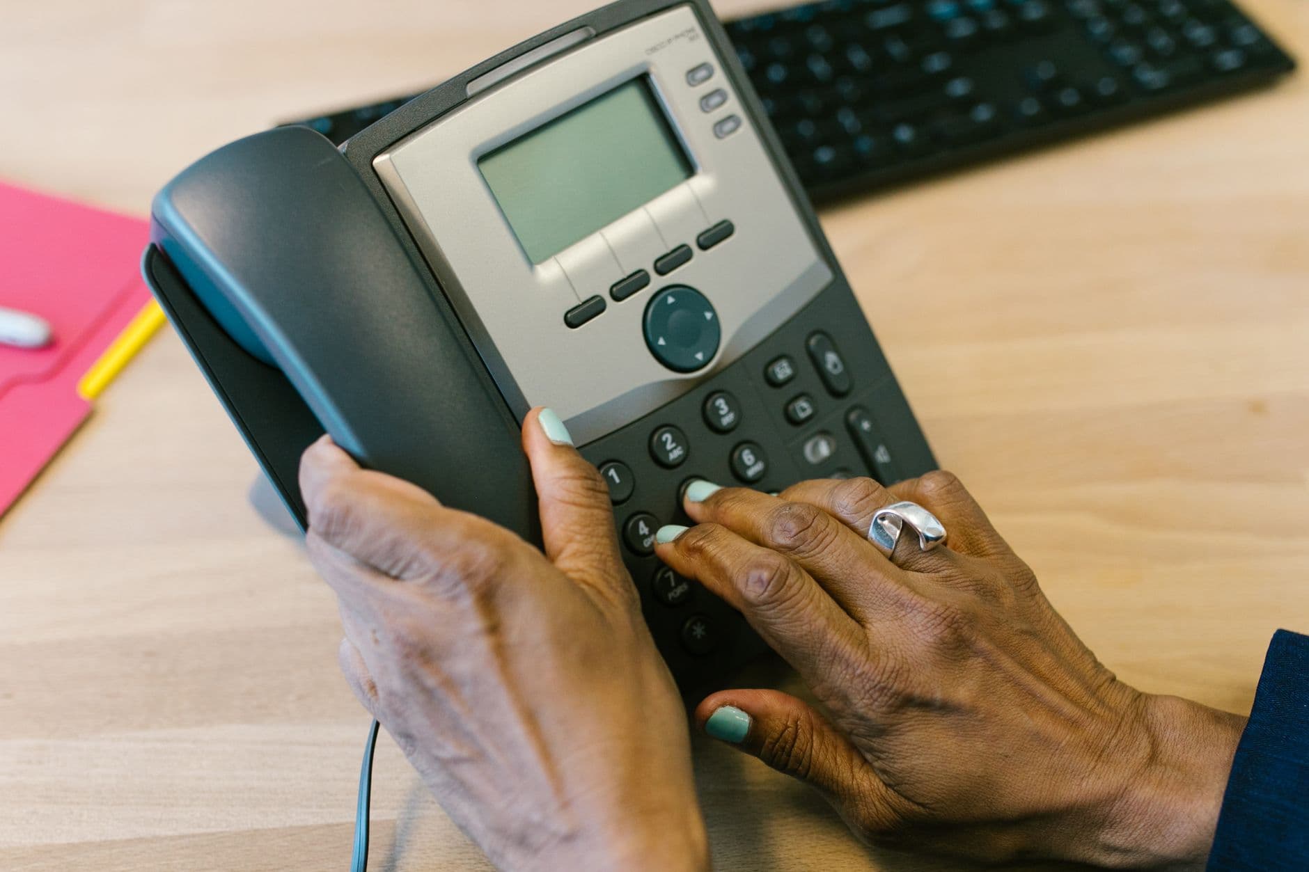 A desk phone in an office after hours